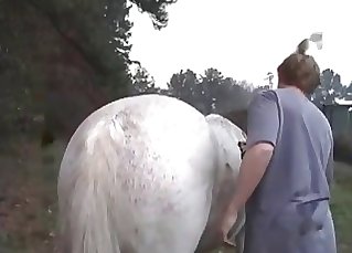Man is fully dominating the crack of this horse