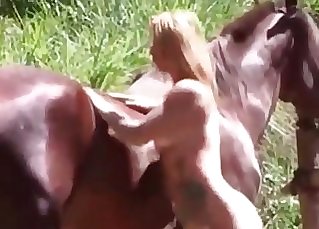 Incredible platinum-blonde slut really loves having sex with a brown stallion